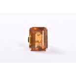A 14ct yellow gold and citrine ring circa 1970s, set with a large emerald-cut citrine, four claw