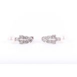 A pair of diamond pearl earrings the white metal mounts each pave set with six round-cut diamonds,