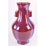 A Chinese Flambé Glazed Porcelain Hu Vase decorated in a rich plum red and purple glaze, 41 cm x