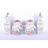 A pair of 20th century Chinese pottery famille rose ginger jars and covers decorated with birds of