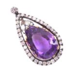 A Victorian old-cut diamond and amethyst drop pendant brooch centred with a large faceted pear-cut