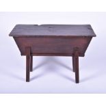 An early 19th century oak dough bin of typical tapering rectangular form, on four plain legs, 72