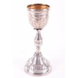 A 19th century Continental Judaica silver gilt chalice circa 1800, the body heavily decorated with