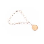 An Italian yellow gold bracelet suspended with a 22ct yellow gold American 2 1/2 dollar coin.