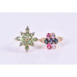 A 9ct yellow gold and mint green garnet cluster ring set with oval-cut garnets and white topaz
