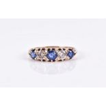 A 15ct yellow gold, diamond, and blue gemstone ring set with two diamonds of approximately 0.40