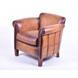 A contemporary leather armchair on tapering front legs, 82 cm wide x 76 cm high, the seat 55 cm