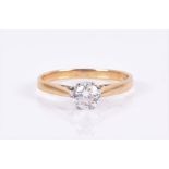 An 18ct yellow gold and solitaire diamond ring set with a round brilliant-cut diamond of