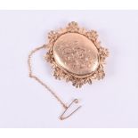 A 9ct yellow gold locket pendant set with a locket opening to front to reveal double portrait
