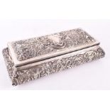 A late Victorian silver box London 1897, William Comyns, of rectangular form, the tapered body