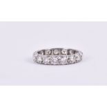 A diamond eternity ring set with round-cut diamonds of approximately 1.40 carats combined, set in