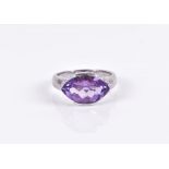 A 9ct white gold, diamond, and amethyst ring set with a faceted marquise-cut amethyst, set