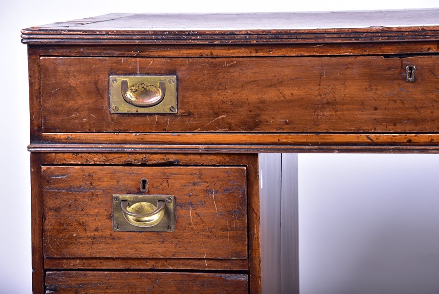 An Edwardian oak nine drawer pedestal desk with brass campaign handles, 101 cm x 79 cm x 54 cm. - Image 5 of 9