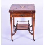 An Edwardian mahogany and inlaid envelope card table  with single drawer, on four tapering legs