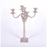 A large silver plated candelabra with four sconces on scroll arms, the central sconce on a tall