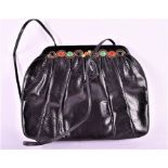 A Judith Leiber vintage lizard skin clutch / shoulder bag  the black leather exterior is trimmed