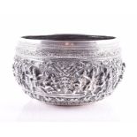 A late 19th / early 20th century embossed Burmese silver rice bowl of military interest with