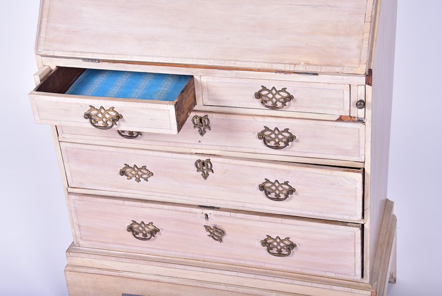A 20th century child's stripped-wood small bureau the drop opening to reveal a compartmentalised - Image 2 of 6