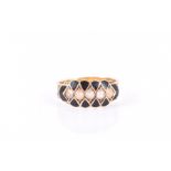 An 18ct yellow gold Victorian mourning ring set with pearls within a chequered black enamel
