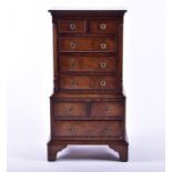 A Bevan Funnell miniature apprentice narrow chest with eight drawers on bracket feet, 76.5 cm high x