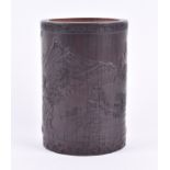 A Chinese carved bamboo brush pot relief decorated with a stylised censer to one side bearing a four