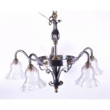 An Arts & Crafts style pendant brass chandelier of steel and brass construction, with scrolled