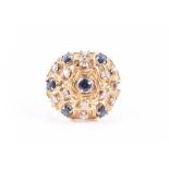 An unusual 18ct yellow gold, diamond, and sapphire ring of bombe form, centred with a round-cut