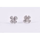 A pair of 18ct white gold and diamond floral ear studs the four petals pave-set with diamonds, 11 mm
