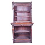 A late 19th century converted carved oak tall bookcase with stylised overlapping leaf decoration