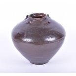 A Chinese brown glazed stoneware Martaban jar of bulbous form, with four loops handles to the top,