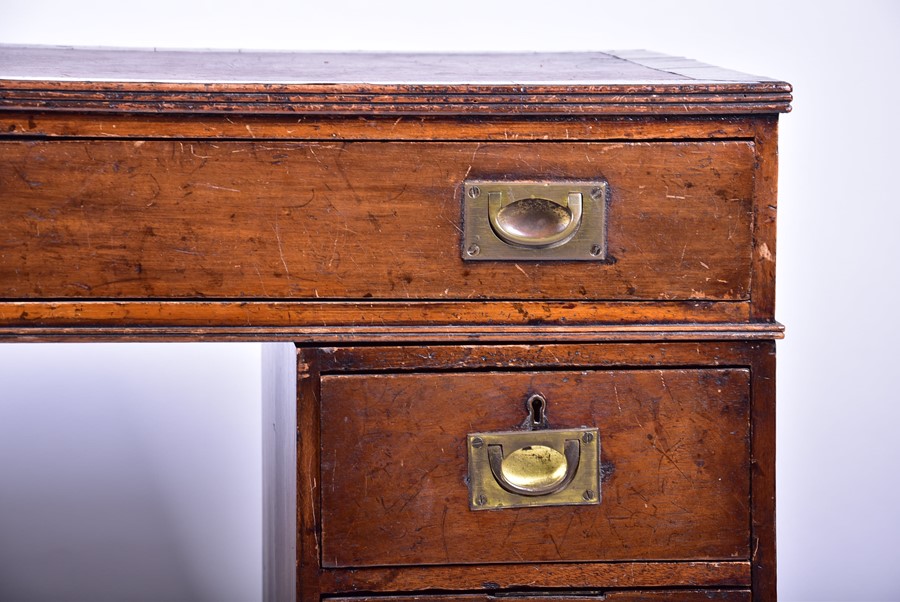 An Edwardian oak nine drawer pedestal desk with brass campaign handles, 101 cm x 79 cm x 54 cm. - Image 6 of 9