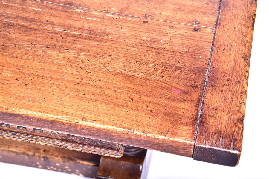 A large 18th century style oak refectory table the plank top supported on very large turned and - Image 4 of 6