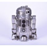 An R2-D2 brushed steel wood burning heater realistically modelled as the iconic Star Wars character,