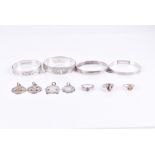 A group of silver jewellery items including four various silver bangle bracelets, a silver and