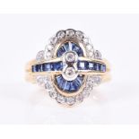 An 18ct yellow gold, diamond and sapphire dress ring centred with two collet-set diamonds, within
