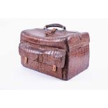 A late Victorian crocodile skin Gladstone travelling bag the twin-hinged flaps opening to reveal a