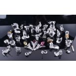 A large collection of Swarovski crystal glass figures to include fish, snowmen, birds and others,