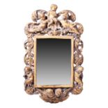 A 19th century giltwood framed Italian wall mirror modelled with winged and musical cherubs on all