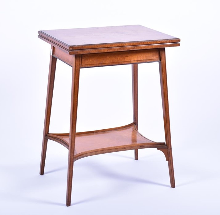 A late 19th century inlaid satinwood folding table the top inset with marquetry detail of musical