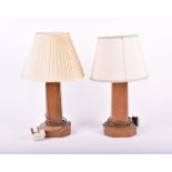 A pair of Arts & Crafts wooden table lamps of obelisk form on raised octagonal bases, attributed