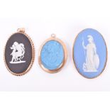 A 9ct yellow gold and black jasperware pendant by Wedgwood, depicting a classical scene of a woman