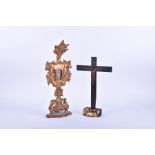 An antique possibly 18th century painted cross on stand, together with a carved gilt-wood and