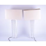 Pair of 20th century stacked lucite lamps with rectangular matching shades, the bases 52 cm high.