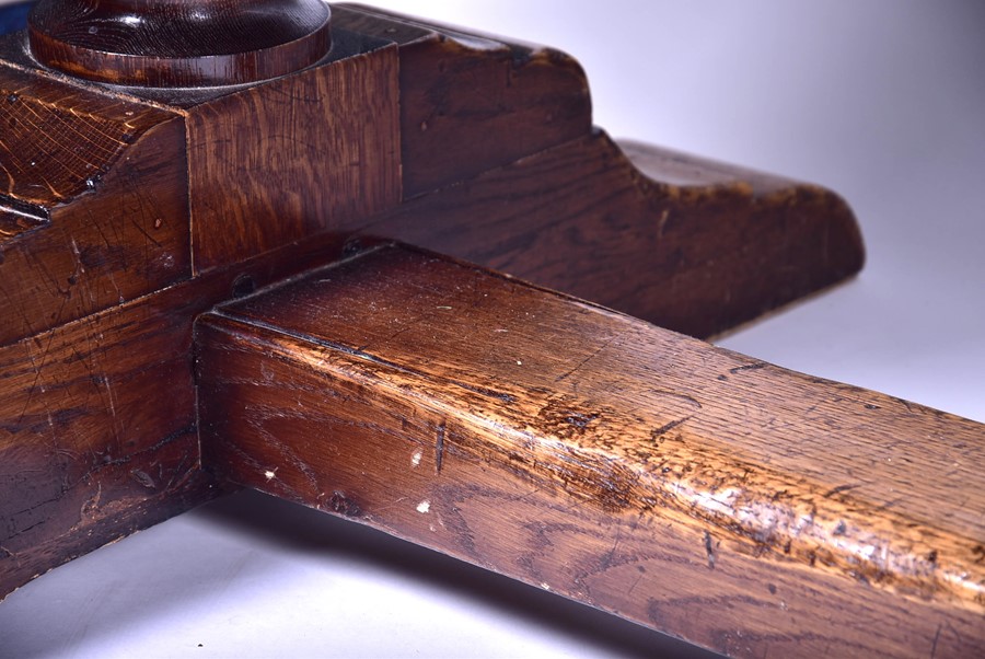 A large 18th century style oak refectory table the plank top supported on very large turned and - Image 6 of 6