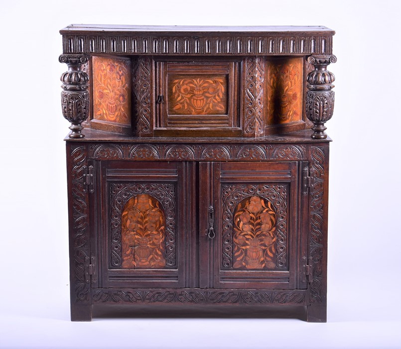 An English oak marquetry press / court cupboard in the 17th century style probably late 19th