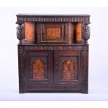An English oak marquetry press / court cupboard in the 17th century style probably late 19th