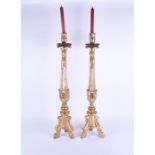 A pair of large gilt wood pricket candlesticks 20th century, on acanthus leaf decorated columns