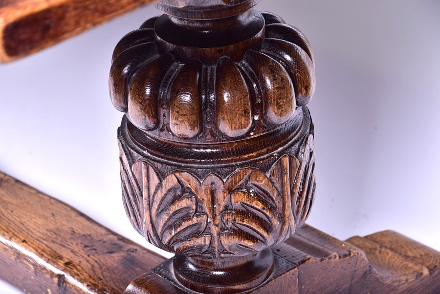 A large 18th century style oak refectory table the plank top supported on very large turned and - Image 2 of 6