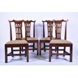 A set of four George III mahogany chairs in the pagoda style, after a design by Thomas