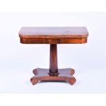 A William IV rosewood fold-over tea table with swivel top, the inverted tapering column on a